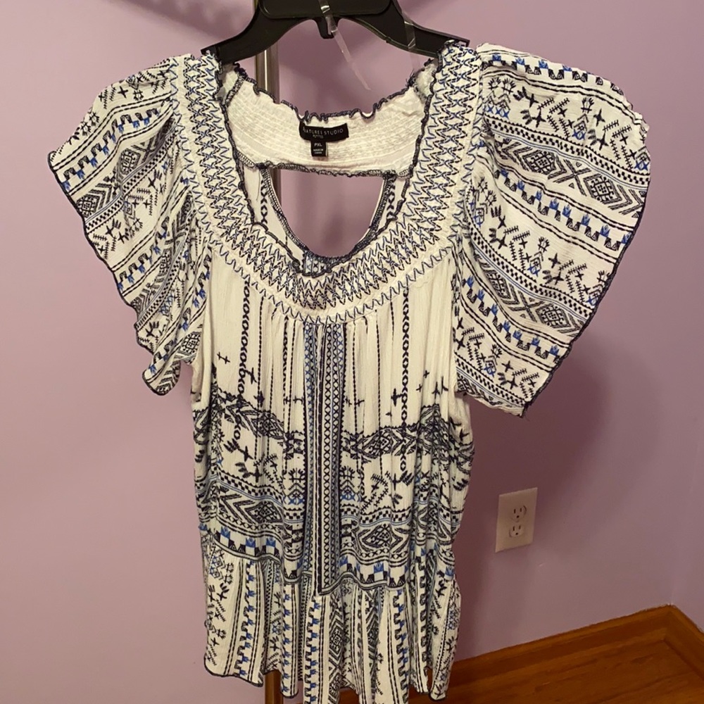 Black, white, light blue. Aztec design.